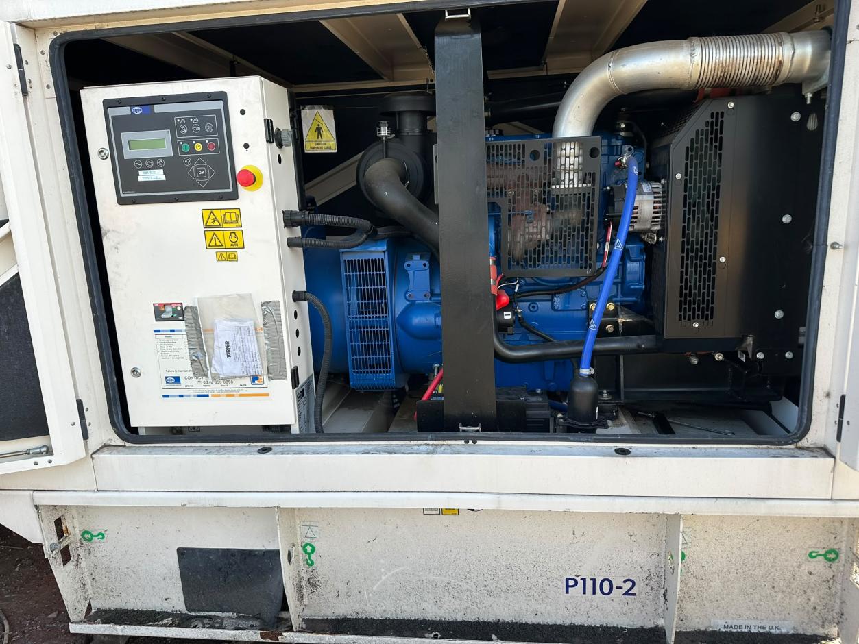 Open canopy showing Perkins engine and mounted control panel - 2012 used 100 kVA prime / 110 kVA standby generator