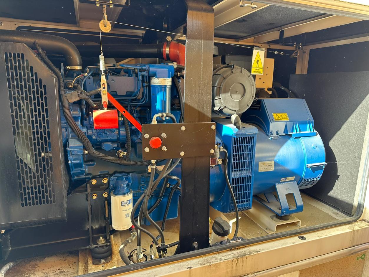 Perkins engine and Leroy Somer alternator inside acoustic enclosure - 2012 used 100 kVA prime / 110 kVA standby generator